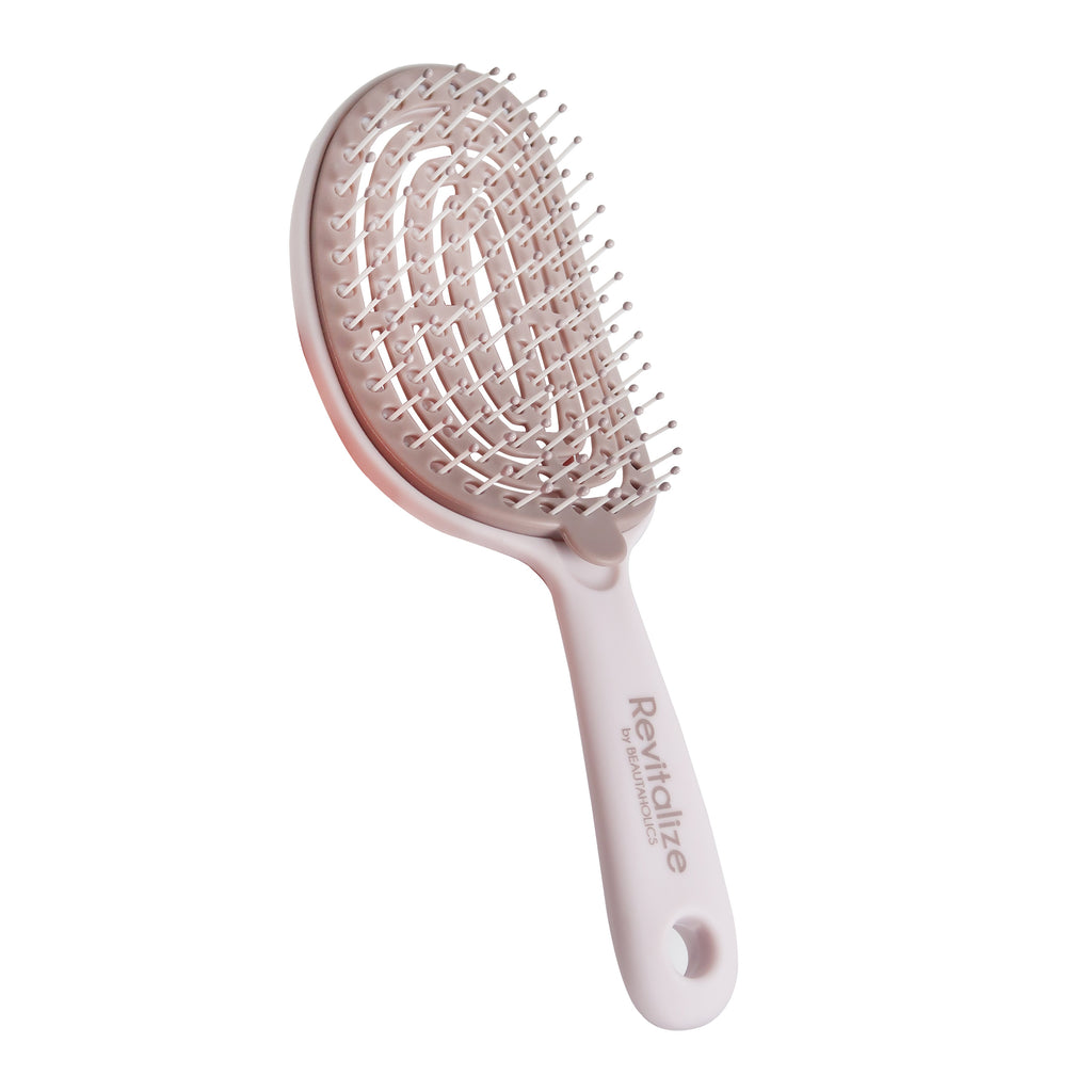 Taupe coloured paddle brush with removable base and Beautaholics Revitalize logo on handle