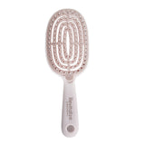 Hairbrush with a unique bristle pattern on a white background, featuring the brand 'Revitalize'.